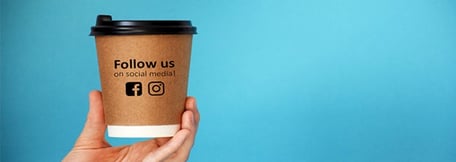 socials on coffee cup
